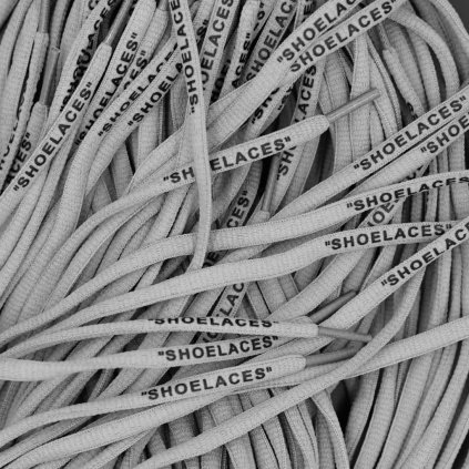 Grey Off-White oval replacement shoelaces with “SHOELACES” print — designed for Nike Air Force 1, Air Jordan, Dunk and Air Max.