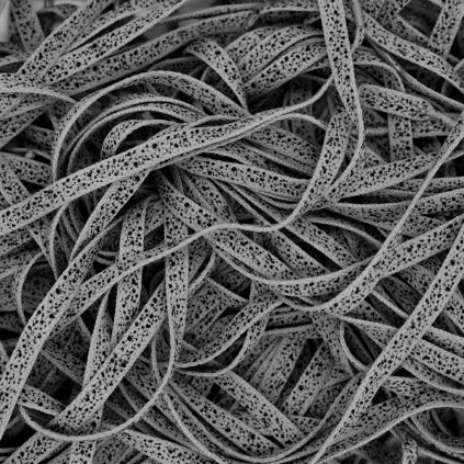 Grey Air Jordan 4 Cement flat shoelaces — neutral 8 mm flat with black speckled “cement” pattern; OEM-style replacement for AJ4 White/Military/UNC colourways.