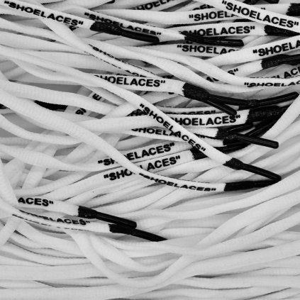 White Off-White oval shoelaces with black tips — clean oval profile for Nike Air Force 1, Air Jordan, Dunk and Air Max.