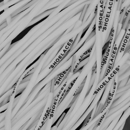 White Off-White oval replacement shoelaces with “SHOELACES” print — made for Nike Air Force 1, Air Jordan, Dunk and Air Max.
