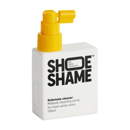 Wiping away grime from a midsole with microfiber after using Solemate spray