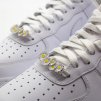 Daisy lace lock styled near the top eyelets of a sneaker for balanced look
