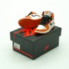 3D mini sneaker keychain in AJ1 Reverse Shattered Backboard style attached to keys