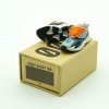 Close-up side profile of Yeezy 700 “Wave Runner” mini sneaker keychain showing teal panels and orange midsole accents