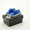 Close-up of blue silk-pattern mini sneaker keychain (AF1 CLOT style)