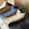 Lineup of AJ1 monochrome sneaker planters in black, grey, brown, white and beige
