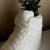 Close-up of white AJ1 planter highlighting crisp edges