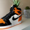 Close-up of 3D printed AJ1 “Shattered Backboard” sneaker planter styled on a shelf next to shoeboxes