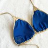 5.Zlaté bikiny s kontrastní modrou podšívkou a symboly péče uvnitř1200x1200