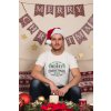 t shirt mockup of a man wearing a christmas hat at home 30172