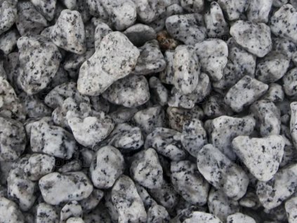 Speckled grey granite pebbles for garden architecture and house decoration - natural stones.