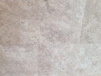 Travertine floor tiles Classic Royal show a close-up of smooth beige travertine surface with subtle natural texture.