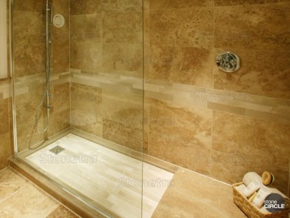Bathroom with walk-in shower clad in travertine – Travertine Gold CC, filled and honed