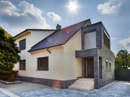 Modern house facade with natural stone cladding from Marble Black split face, elegant and durable natural stone wall