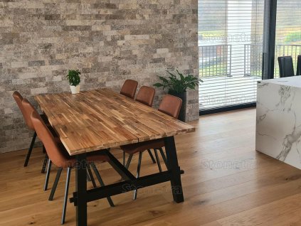 Dining room wall covered with natural stone Travertine Silver split face, stylish decorative natural stone wall with modern character