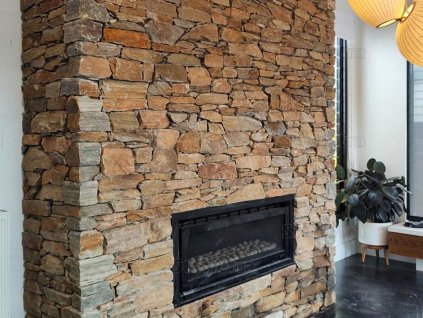 Fireplace stone wall with natural stone Quartzite Altais rock face