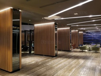 Luxury lobby interior with continuous natural stone floor in Travertine Madeira VC, filled and honed