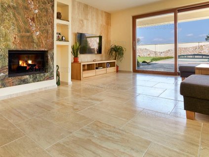 Bright living room with polished natural stone flooring – Travertine Classic VC, filled and honed.