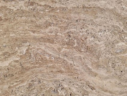 Close-up of beige-brown natural stone surface with flowing texture — Travertine Mocca VC, unfilled and honed large-format tile.