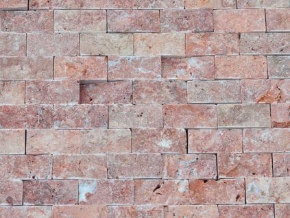 Wall detail with reddish Travertine Red mosaic, 2.5×5 cm split face natural stone.
