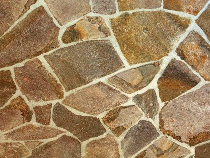 Natural stone Porphyry with irregular reddish-brown texture used for paving and wall cladding