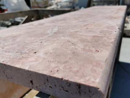 Detail of tumbled stone tread with rounded edge - Travertine Red, 80×25×3 cm, showroom sample..