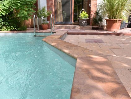Pool surround finished with non-slip natural-stone coping - Sandstone Modak 100×25×3 cm.