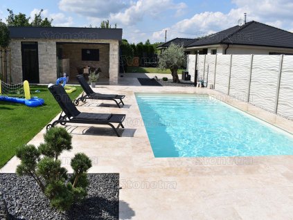 Paving slabs in Travertine Classic used on entrance steps, showing neat sawn risers and a light beige natural stone look.