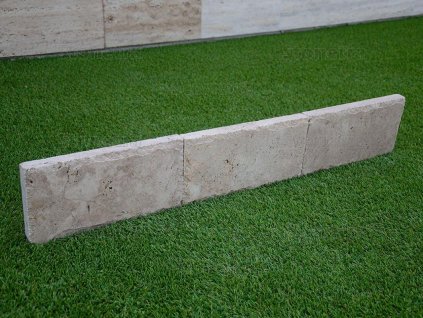 Straight, contemporary natural stone curb with sawn edge — Curbstone Travertine Noche, chiselled edge.