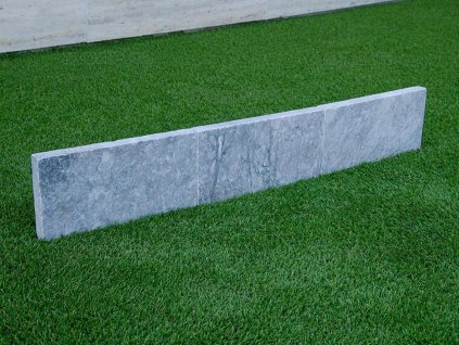 Clean-lined natural stone edging with sawn sides and tumbled surface — Curbstone Marble Lagune, sawn edge, tumbled.