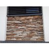 Stone siding Gneis Rusty Mond used on base wall for durable and decorative facade finish.