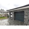 Natural stone wall Slate Grey applied on facade and around garage for modern exterior look.