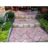 Stone walkway pavers from Travertine Red with chiselled edge used on garden stairs.