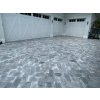 Driveway pavers from Marble Dolphin set in front of a double garage, even grey tone.