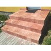 Natural stone tiles Travertine Red French pattern used on an exterior entry staircase leading to a modern yellow facade.