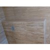 Stone tiles Travertine Classic VC show a polished travertine wall with gentle beige tones.