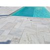 Pool deck pavers marble Alexandria French pattern installed on a spacious sun terrace next to the pool.