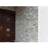 Stone facade cladding Travertine Silver enhances the home entrance with light and dark grey travertine tones.