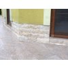 Stacked stone fireplace Travertine Classic split face tumbled used on base walls adds elegance to a house exterior.