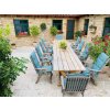 Natural stone patio Travertine Classic French pattern terrace with dining area in the garden.