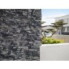 Stone facade cladding Slate Adara shows a close-up detail of dark layered slate panels.