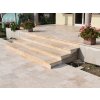 Paving garden slabs with Travertine Light French pattern on garden stairs, side perspective.