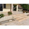 Stone walkway pavers — Travertine Light French pattern used on entrance steps by the doorway, overall view.