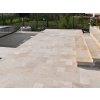 Patio stone pavers — Travertine Light French pattern on a large terrace with matching steps, overall look.