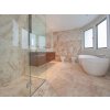 Bathroom tiles Travertine Classic create a timeless natural stone look with soft beige travertine tones and polished surface.