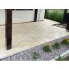 Covered patio with warm beige natural stone flooring – Marble Shells Beige, honed large-format tiles.