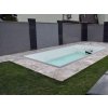 Garden pavers in Travertine Silver French pattern placed around a small garden pool with lawn.