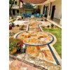 Patio pavers with Travertine Peach French pattern 3 cm tumbled, decorative terrace seating area.