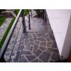 Andesite Grey irregular stone paving on outdoor terrace — natural flagstone walkway with rustic grey tones.