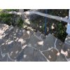 Andesite Grey crazy paving path in garden, natural walkway stone from irregular fieldstones.